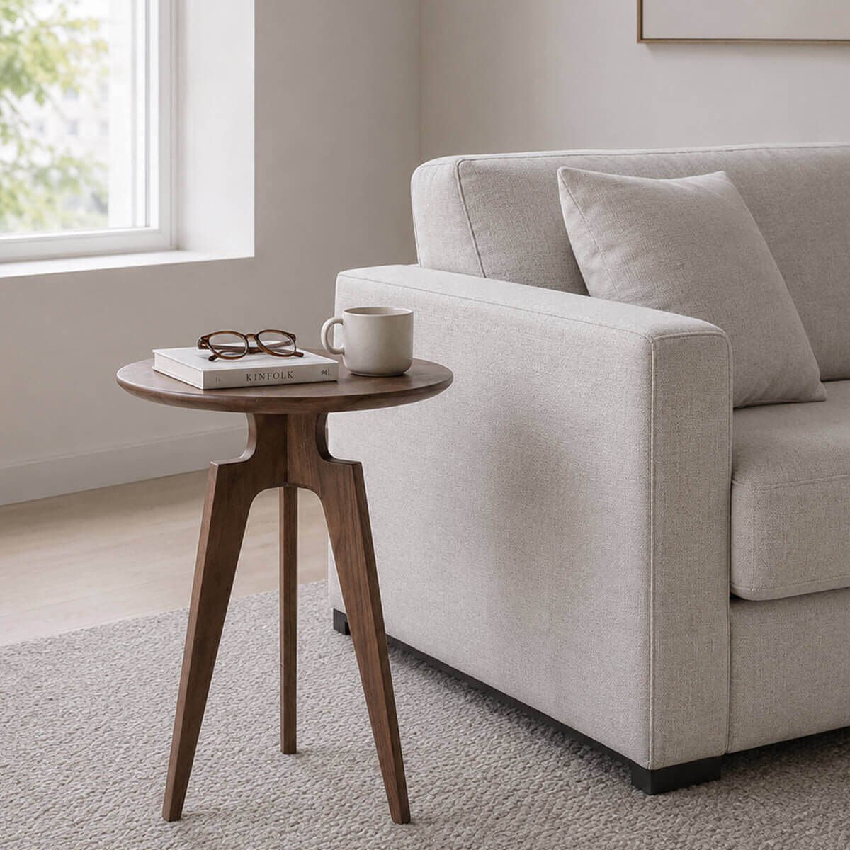 Tobias solid ash side table beside a modern fabric sofa