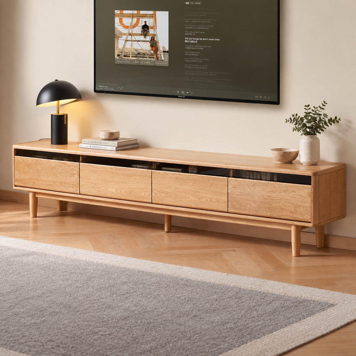 Natural oak Toren TV unit styled beneath a wall-mounted television