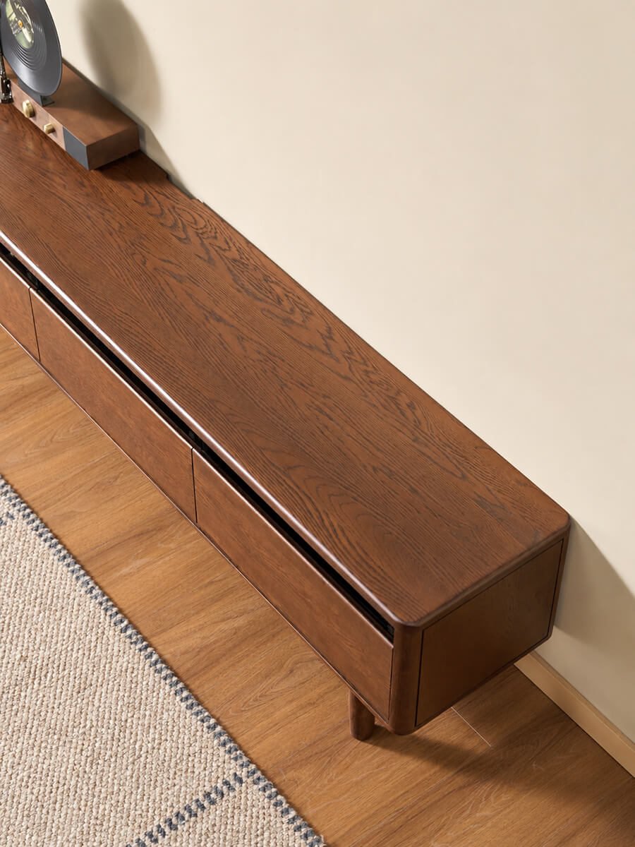 Close-up of the walnut stained oak finish and cable cut-out on the Toren TV unit