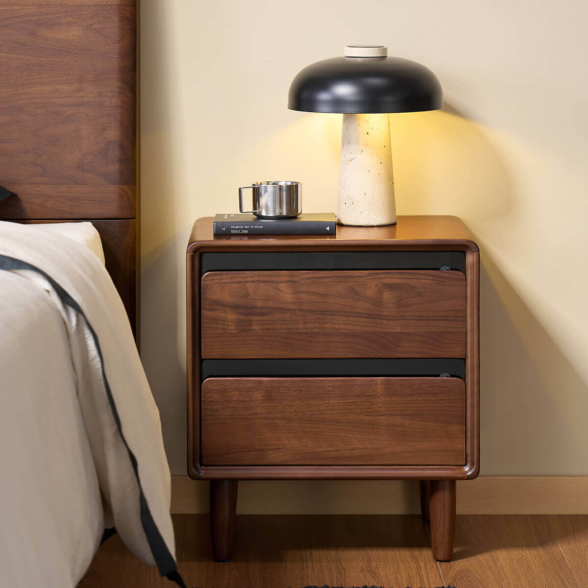 Tura solid walnut bedside table in a modern bedroom