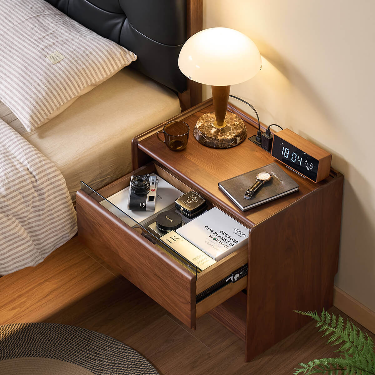 Tura solid walnut bedside table with two drawers open showing practical storage