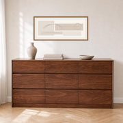 Tura Solid Walnut Chest of 9 Drawers in a modern bedroom