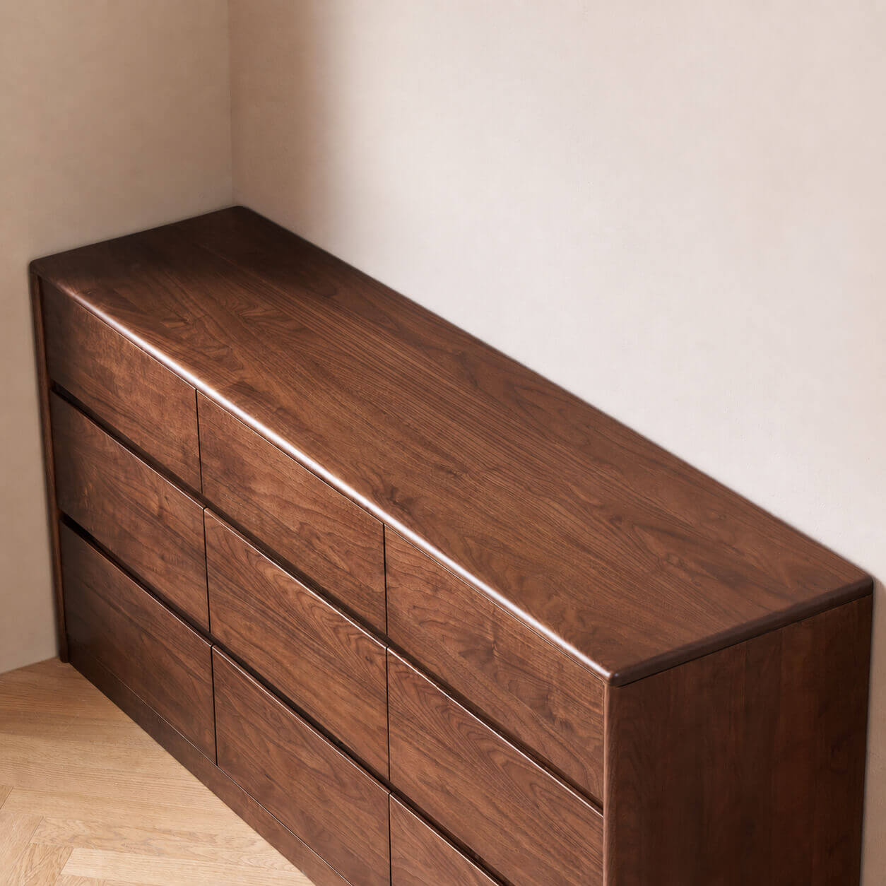 Close-up top view of the Tura Solid Walnut Chest of 9 Drawers