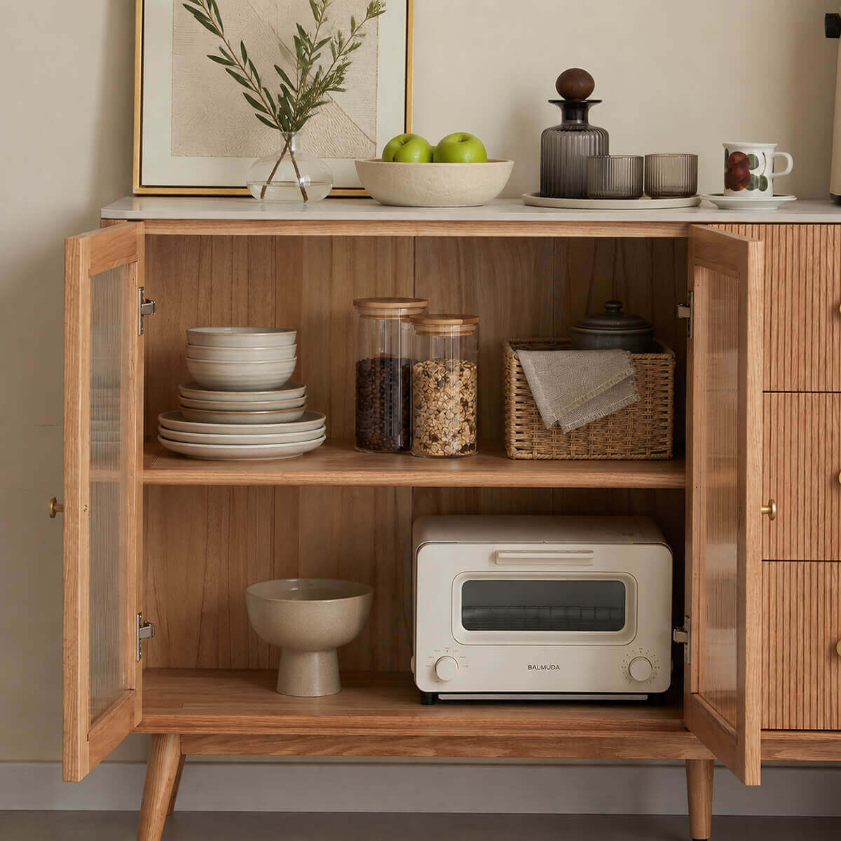 Voss solid oak sideboard with reeded glass doors open, showing the internal shelves and storage space