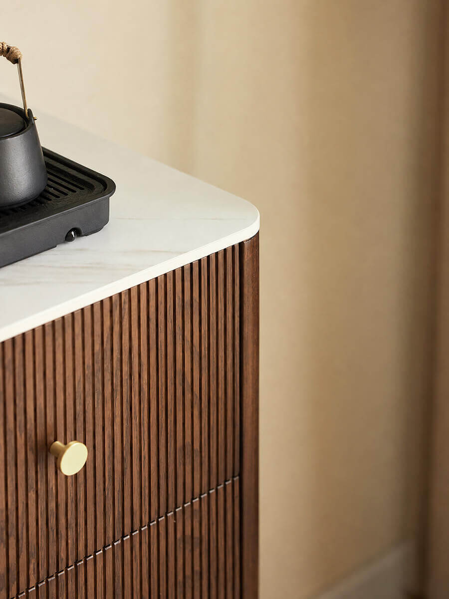 Close-up of Voss solid oak sideboard showing the white sintered stone top and finely grooved drawer front.