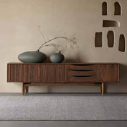 Wave TV Unit in walnut finish styled in a contemporary living room