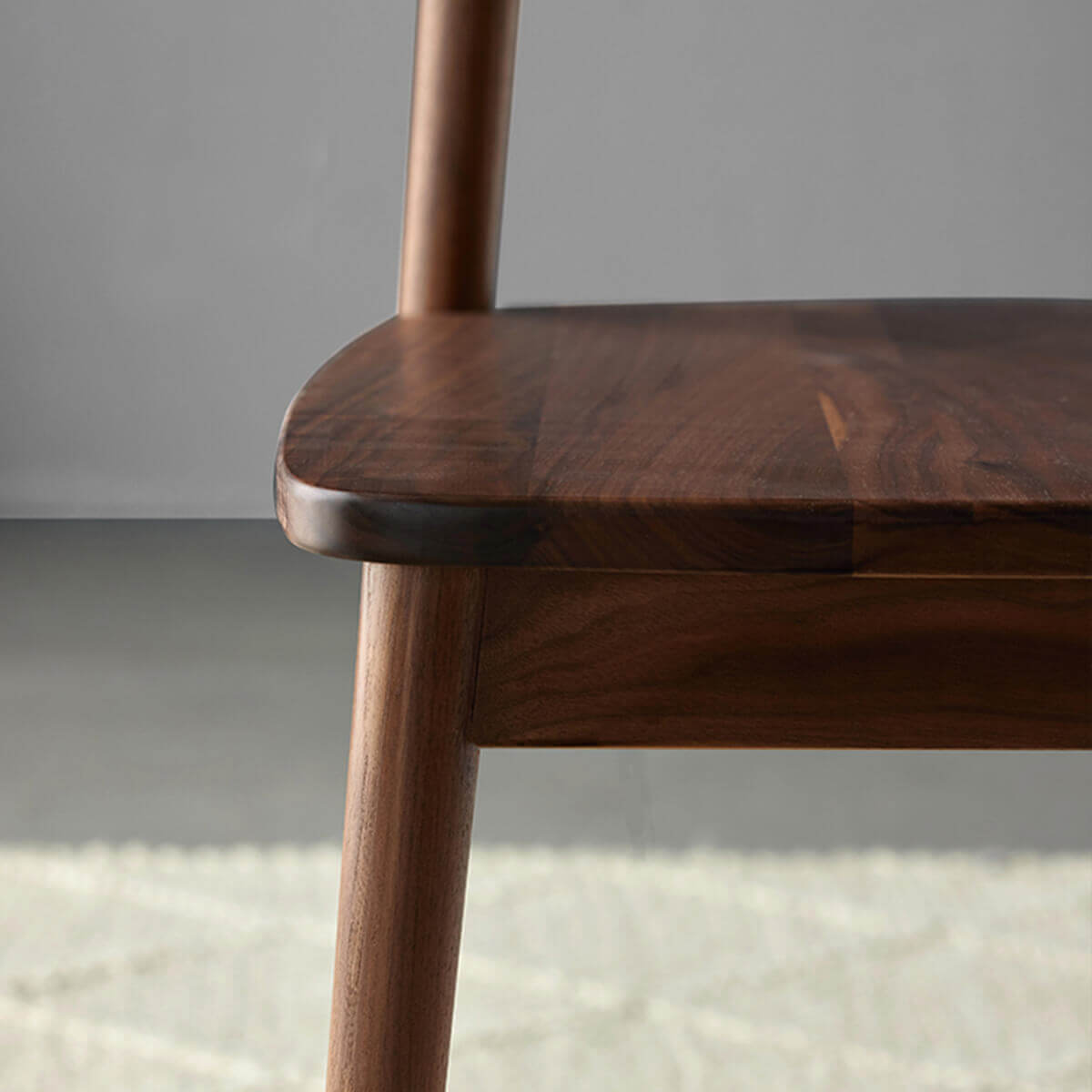Bond Dining Chair solid walnut seat, frame and leg detail