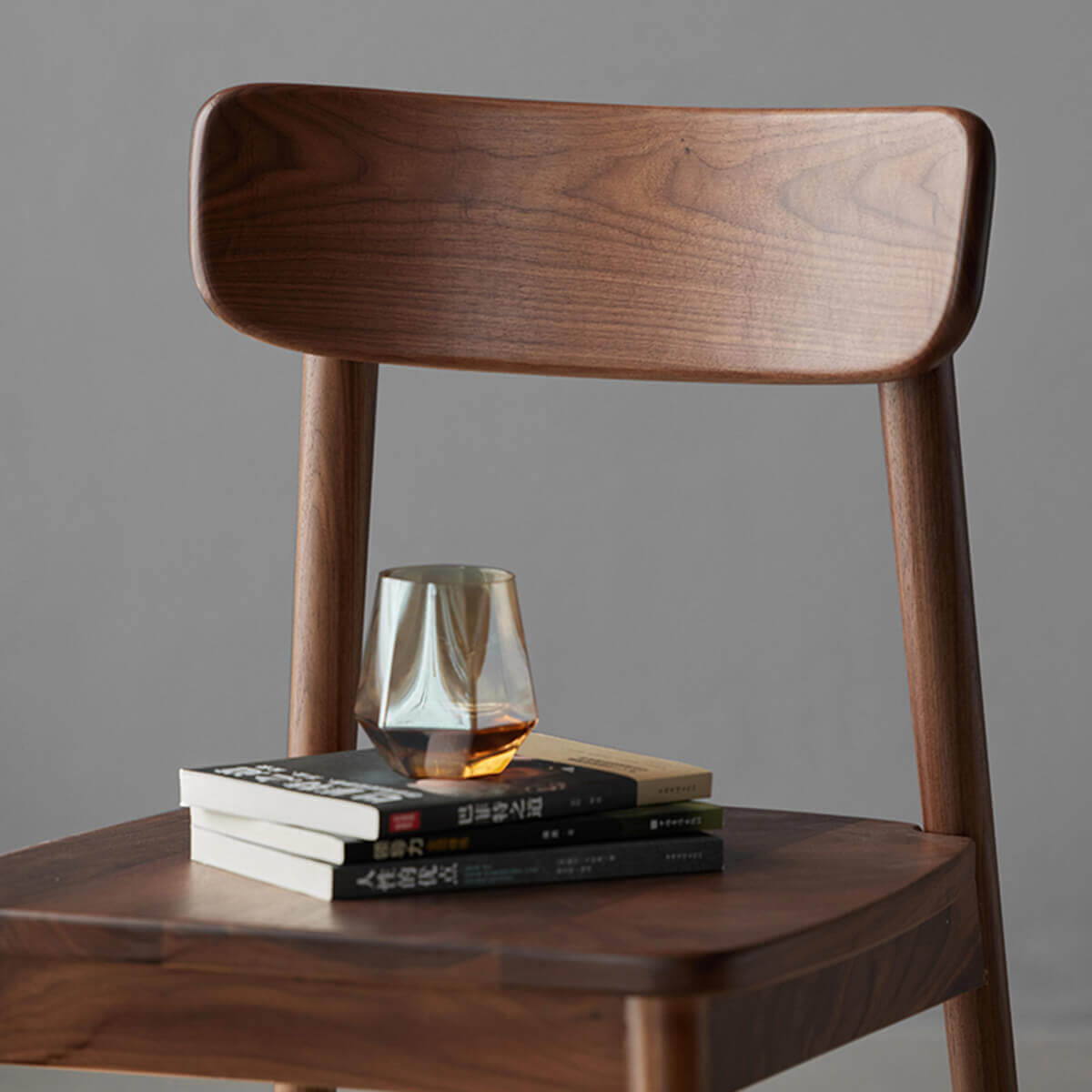 Bond Dining Chair solid walnut backrest and timber seat detail