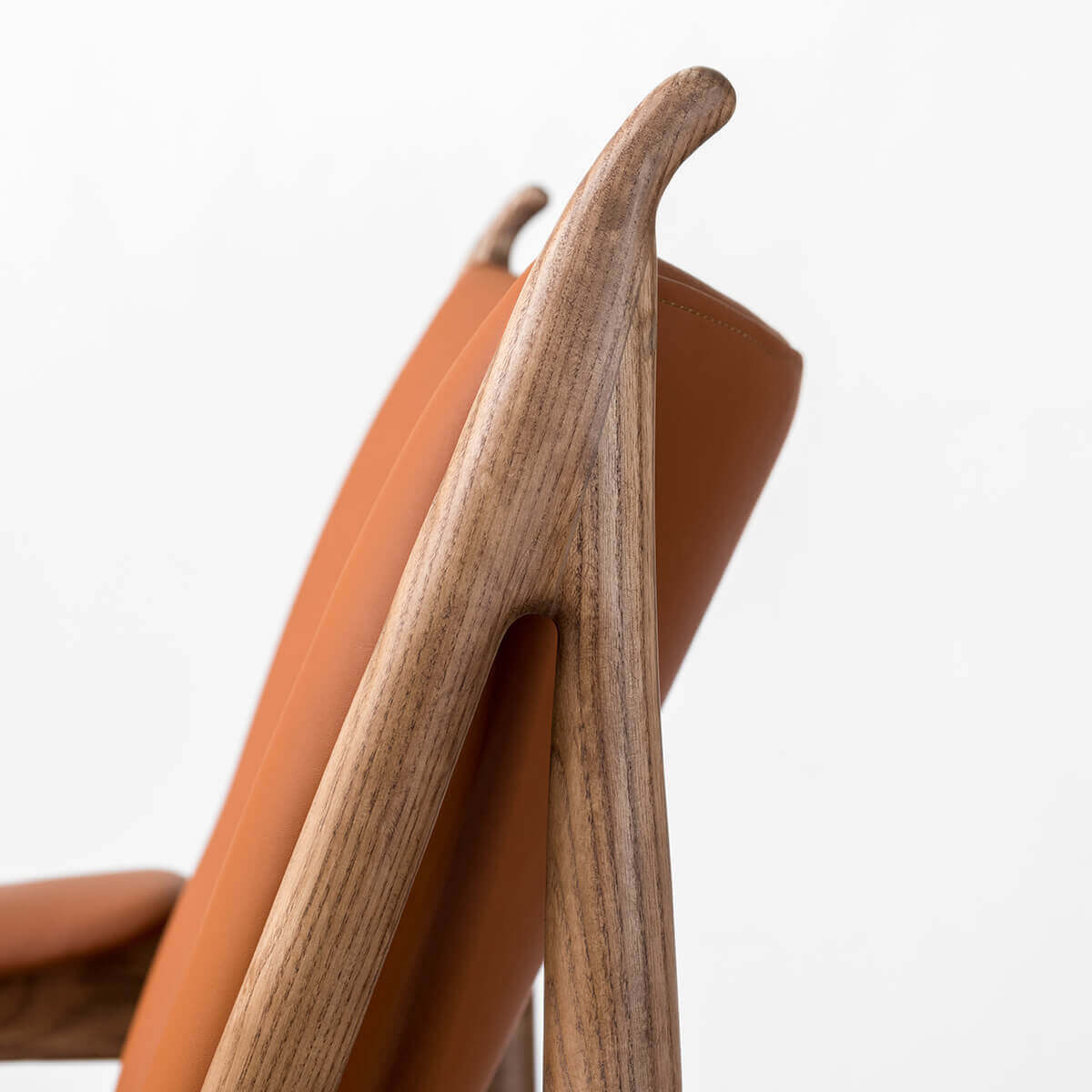 Close-up of side wood frame detail on Chieftain chair replica