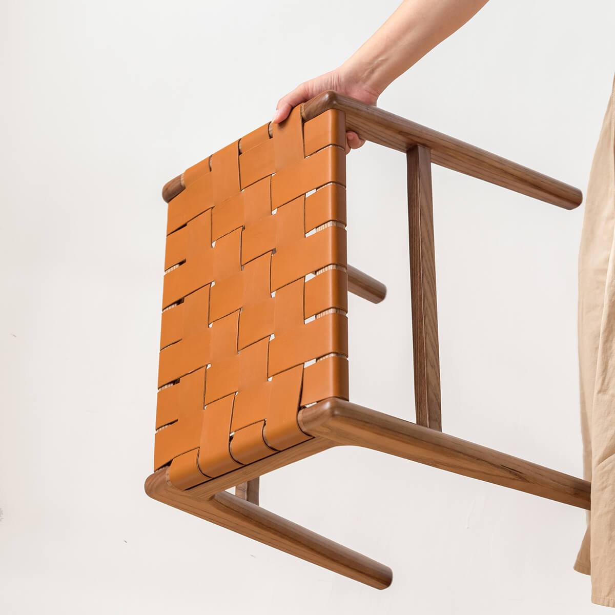 Lightweight Connar saddle leather stool showing easy portability