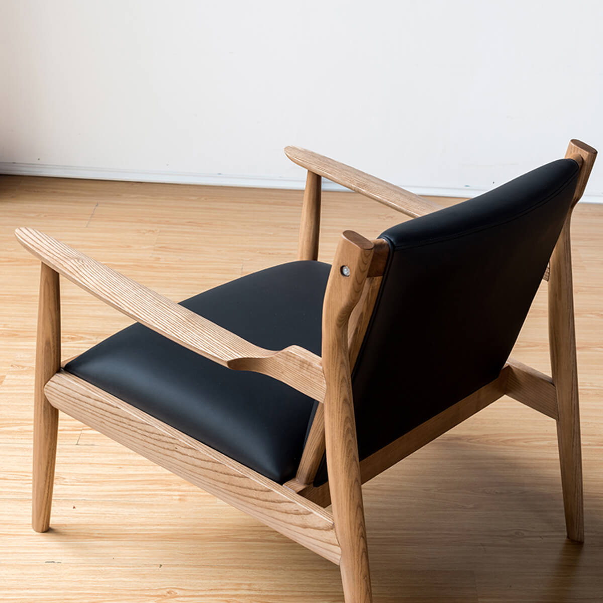 Douk Armchair with Floating Backrest and Blade-Shaped Armrests