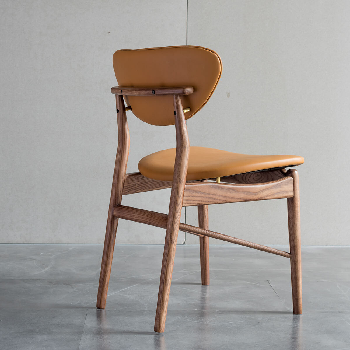 Rear view of the Ellyn solid ash dining chair showing the floating backrest design