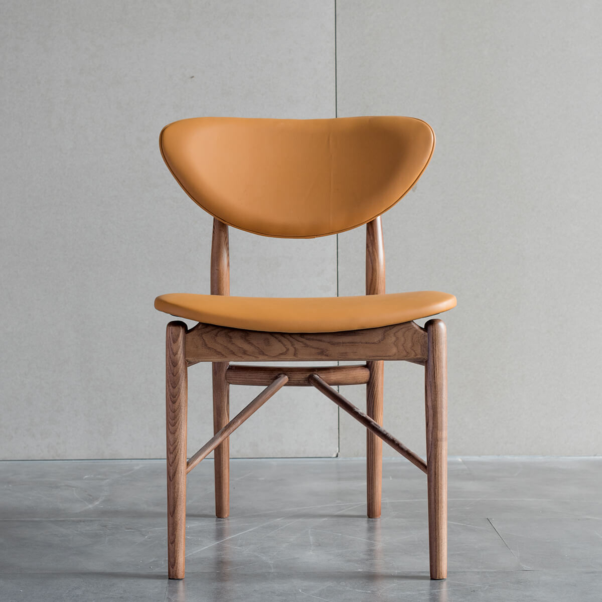Front view of the Ellyn solid ash dining chair with floating backrest