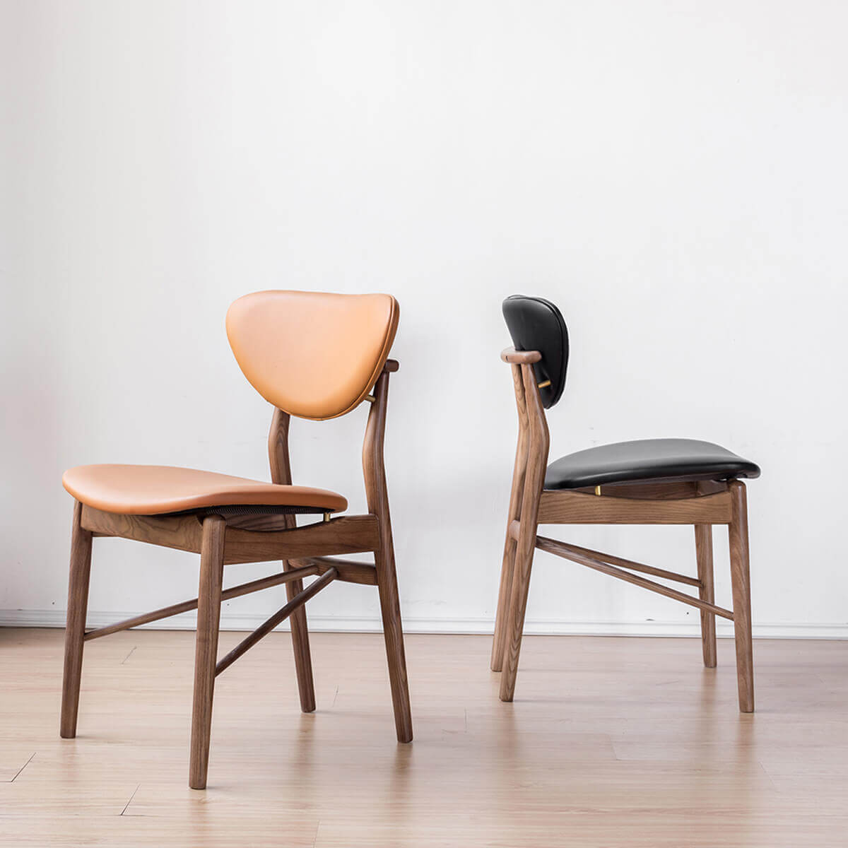 Pair of Ellyn solid ash dining chairs with floating backrests