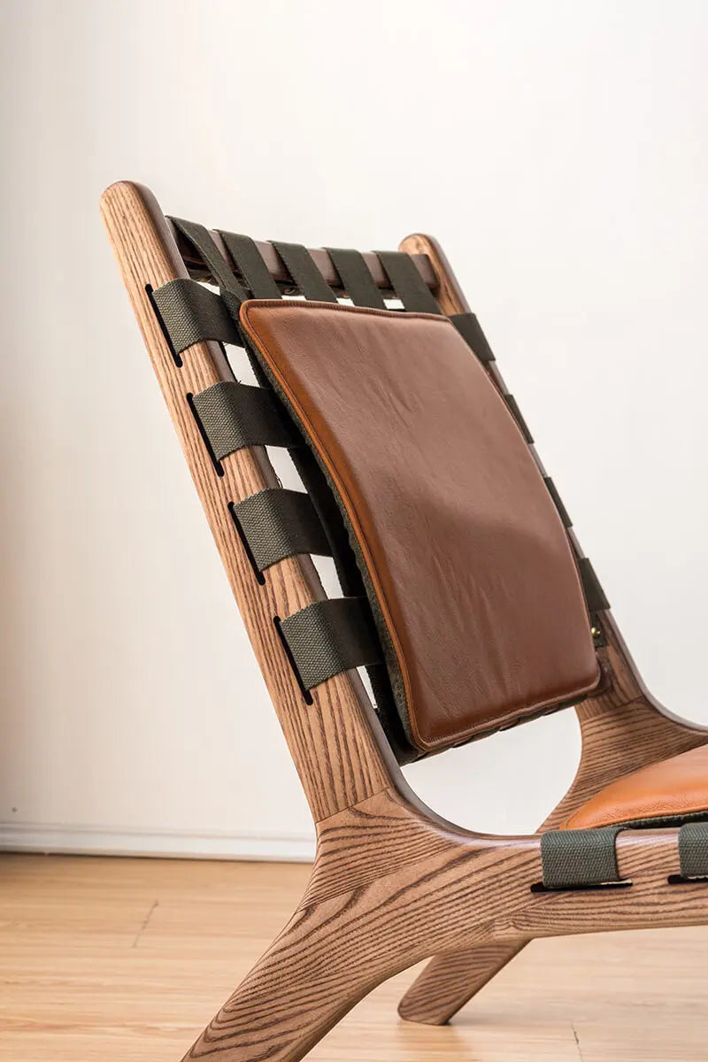 Detailed view of the Julian Armchair backrest and woven canvas construction