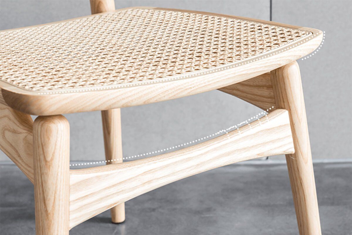 Close-up of the natural Indonesian rattan seat on the Leny Dining Chair
