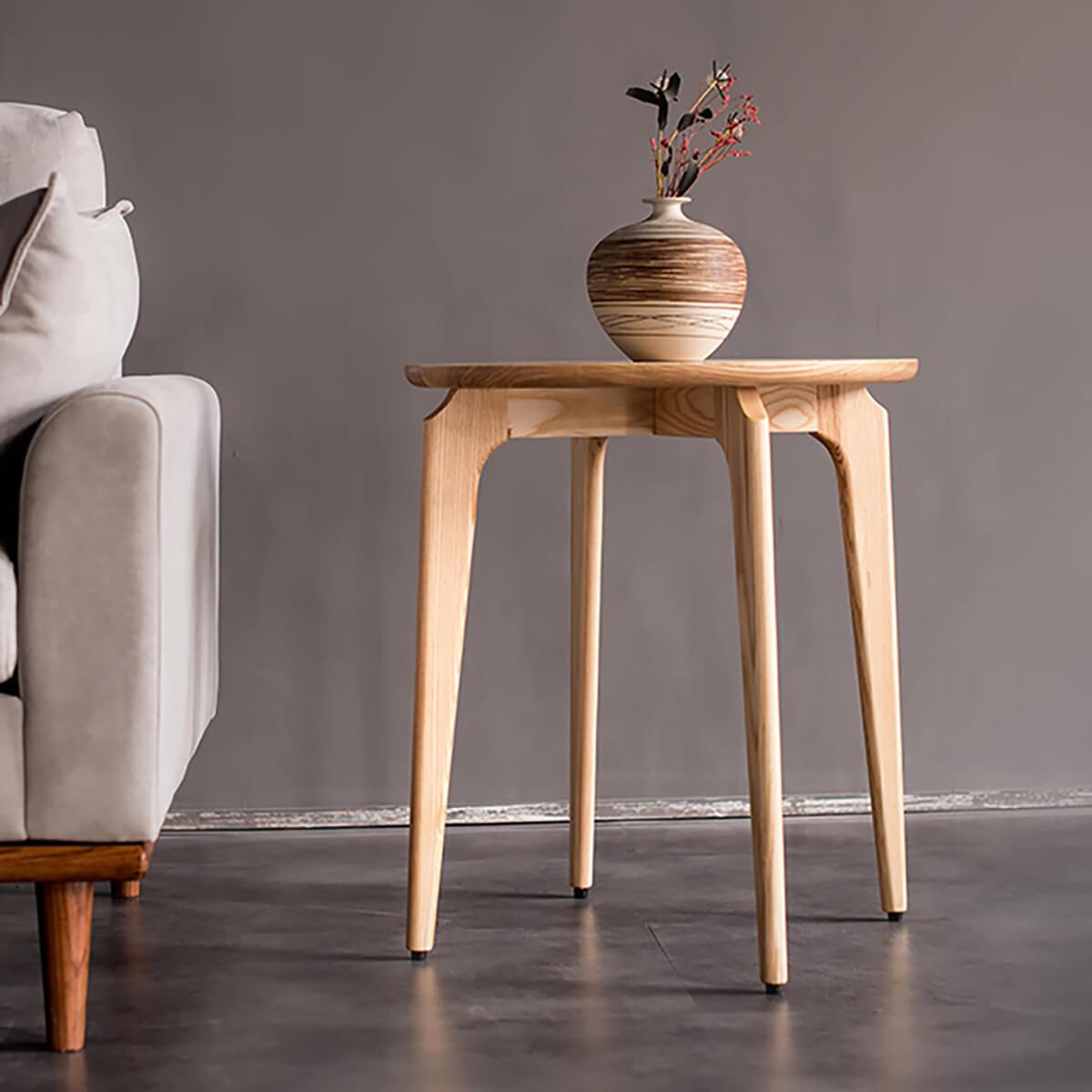 Link solid ash side table styled in a modern living room