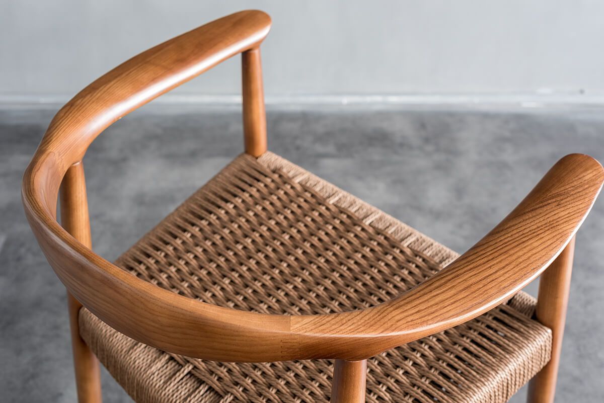 Curved solid ash wood armrest detail of Lund dining chair