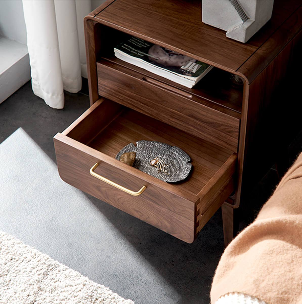 Luxembourg solid walnut bedside table beside upholstered bed