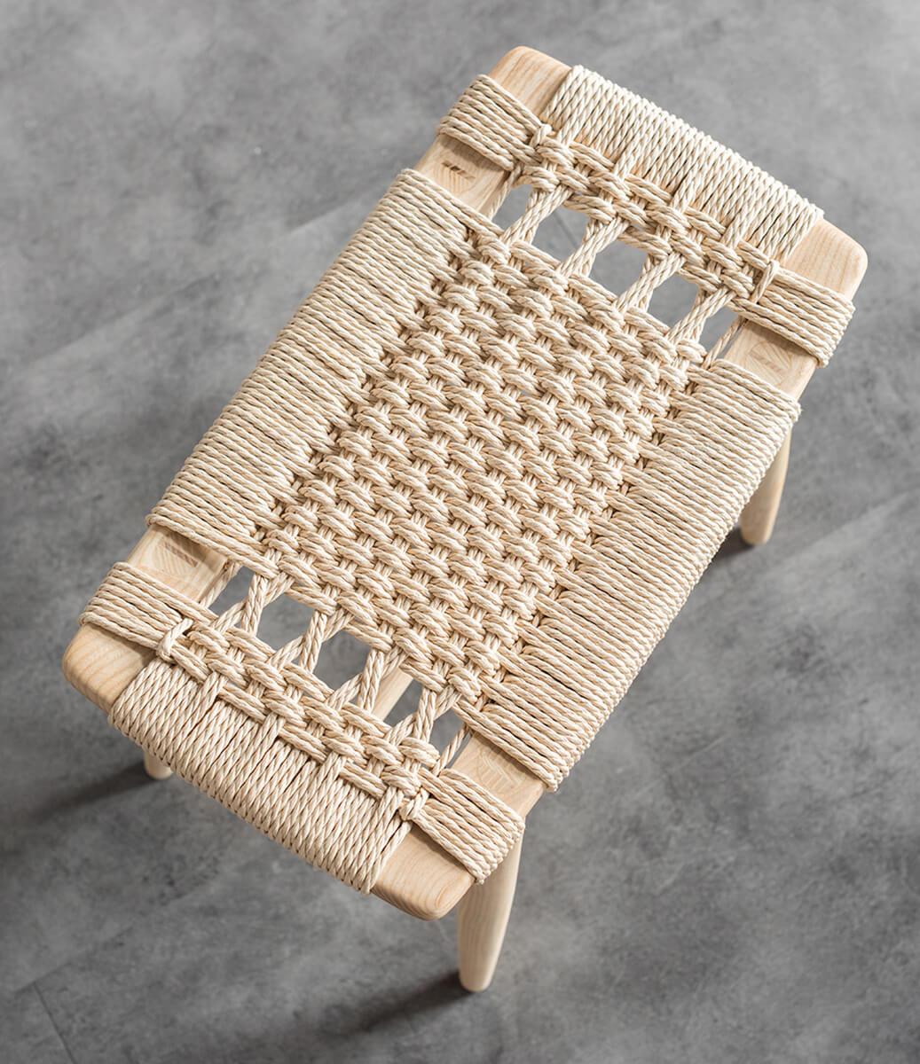 Close-up of the woven paper cord seat on the Malmo stool