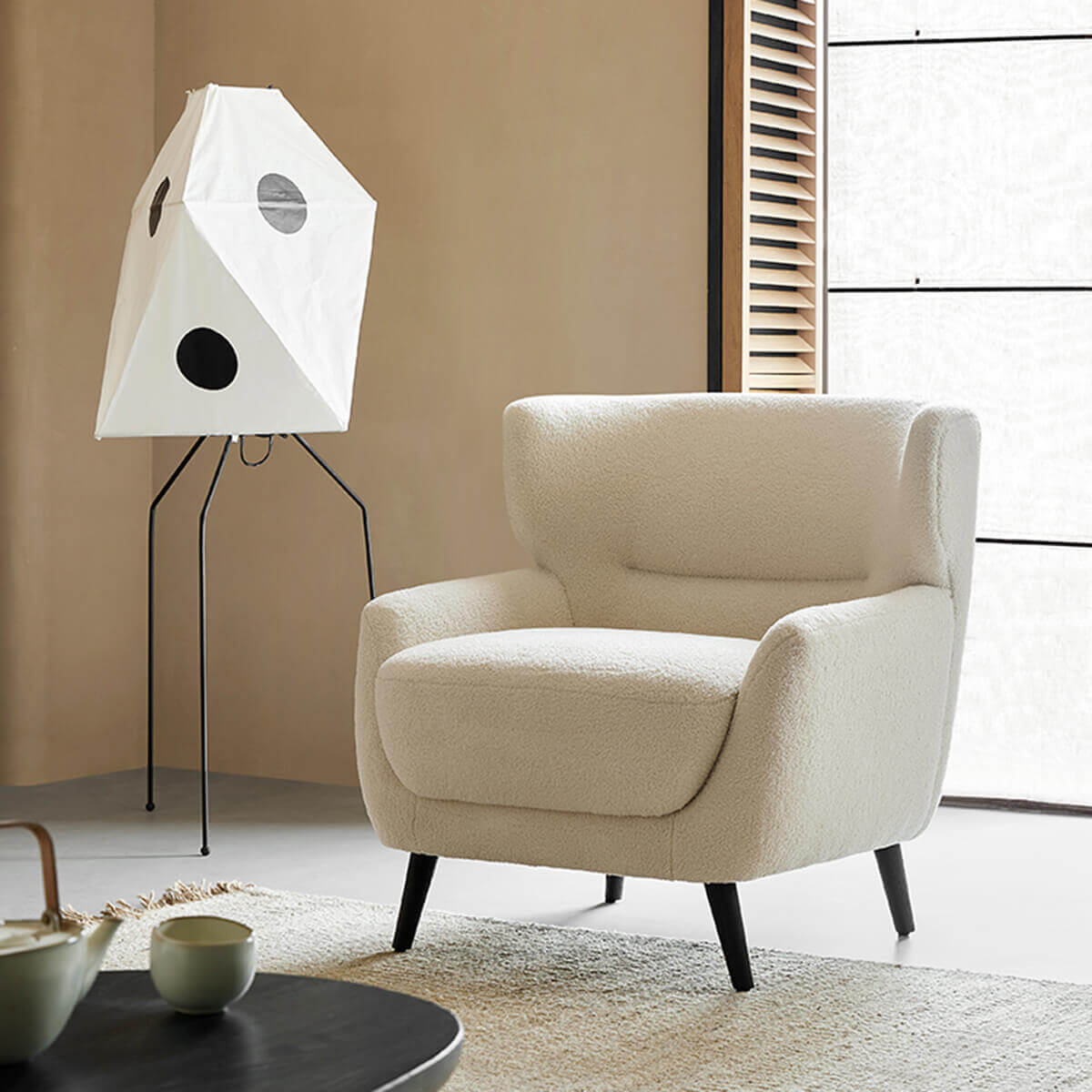Mandy bouclé armchair in a bright reading corner