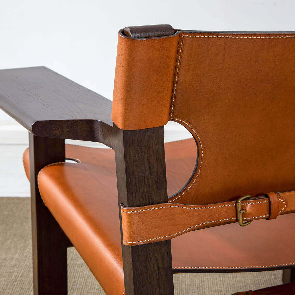 Leather strap and buckle detail of Spanish armchair