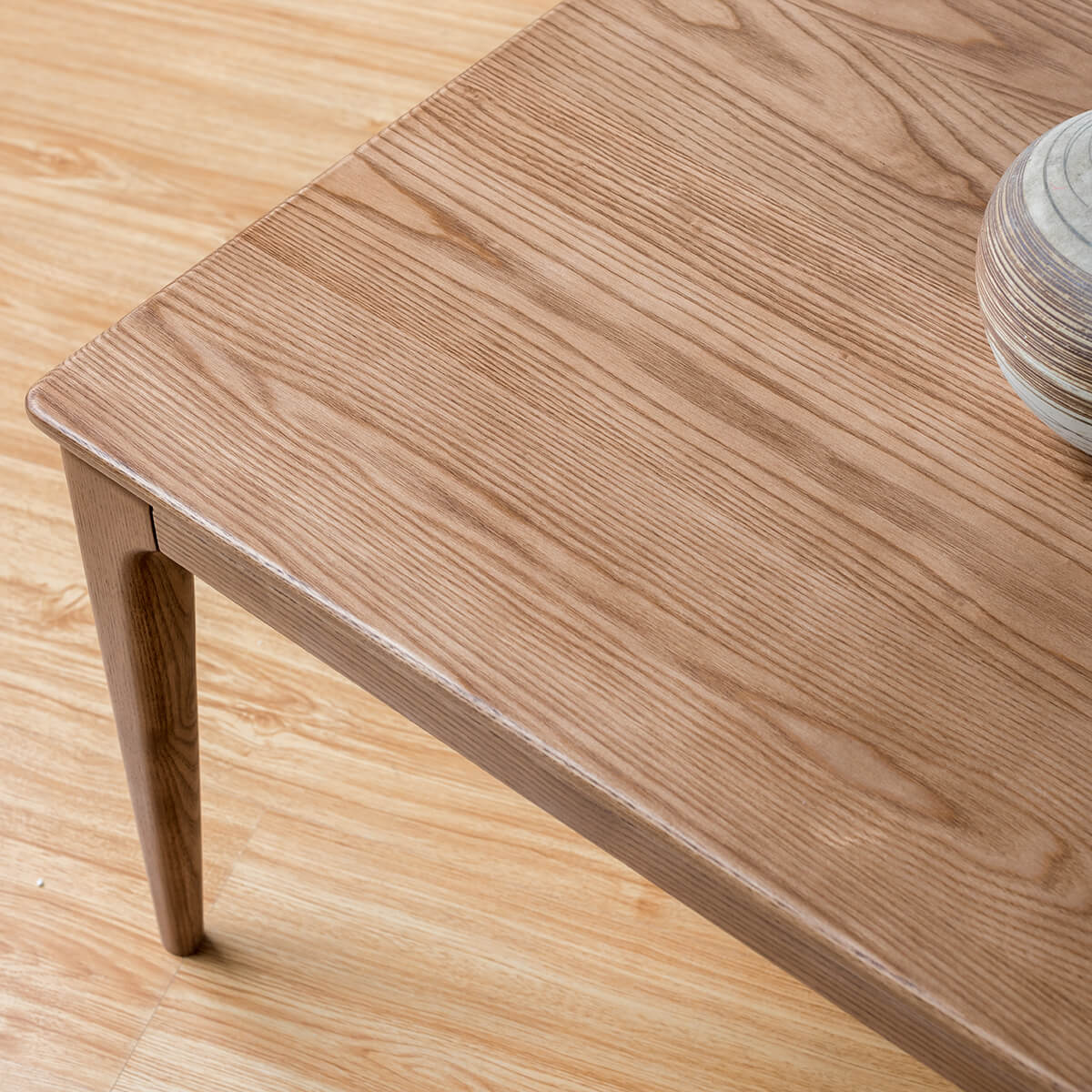 Close-up of the Stockholm solid ash coffee table tabletop